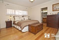 18 Mill Avenue FOREST HILL VIC 3131 Graced by a beautifully manicured rose garden and sitting pretty beyond a picturesque picket fence, this gorgeous single-level home strikes the perfect balance between a classic warm ambience and modern comfort. Wonderfully appointed for peaceful living, stunning timber floors and a pretty leadlight entry permeate a refined formal lounge and dining domain (open-fireplace) capturing tranquil garden vistas while a pristine Stone skylit kitchen with adjoining open plan living/meals area (slow combustion wood heater) serves in style. Three robed bedrooms, including a main bedroom with walk-in robe and ensuite are complemented by a bright central bathroom, ducted heating, evaporative cooling, video intercom, alarm, garden irrigation, covered outdoor pergola for all-season entertaining enveloped by lush fruit trees and double garage plus carport. Located in a quiet, family-friendly locale providing immediate access to Forest Hill chase, bus services Forest Hill Secondary, Parkmore Primary and Emmaus College.  