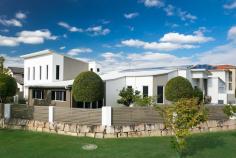  14 Waterbrooke Cct Drewvale QLD 4116 Fourteen on Waterbrooke This prestige executive residence on offer today delivers all that your family requires and more! Welcome to Fourteen on Waterbrooke in Drewvale. Step inside and experience the quality and exceptional architectural design of this residence, all 574 square metres (approx. 61 squares) tailor made for a modern lifestyle. There’s two of everything in this split level, double storey home that sits on a high positioned 824 sqm block of land that overlooks the park. Formal Living A convenience to have when needed, this area is just the right size to have more formal meetings in. Family Dining This area can cater to the largest of families, from birthdays to holiday feasts. There’s room for the whole family and your extra large dining table will not only fit but also look at home in this spacious room. Kitchen Both kitchens in the home come complete with Miele European appliances, gas cooktops, ovens (both gas and electrical), steam oven and a dishwasher in the main kitchen. Granite bench tops and durable 2 pac cabinetry give both kitchens a stylish appearance. A superb butler’s pantry in the main kitchen will ensure you have all the space for your culinary goods. It’s a joy to create new dishes or preparing those delicious family favourites in these well-planned kitchens! Study Decorate it to your taste and you will find an excellent functional room for the children’s homework or your home office. Bedrooms There are six in total, including two master suites and four generously portioned rooms for the children and guests. Each of the bedrooms has their own built in robes so that storage space isn’t a worry. Library or Music Room The musically talented in the family will love their time playing musical instruments or listening to their favourite music away from the other common areas of the home. Mum and Dad can enjoy a gentle relaxing read, cozying up with a good book and a hot drink here. Media Room The home has a massive media room where the whole family and friends can get together to enjoy a movie or the latest game. Family Room The family room is filled with plenty of natural light and is the ideal place where the family can get together, catch up and share the day’s happenings. Overlooking the park, this room is fitted with block-out screens for easy automatic shade and extra privacy when needed. Master Suites There are two master suites, both of which are gloriously appointed with high ceilings and are luxuriously spacious. Each of the master suites have their own en-suites that are fully tiled, fitted with spa baths, shower amenities and double vanities. Ladies, the generously sized walk in robes give you the chance to showcase all those clothes, handbags and glorious shoes! This property is situated in a sought after area of Drewvale and is close to all schools, ranging from childcare, kindergarten, primary schools and the highly regarded Stretton College being just a short walk away. A lovely small park is a wonderful addition to the surrounds and gives a beautiful green vista looking out from the family room. Nearby buses to the city approximately 2 mins walk, shopping centres and restaurants. Features • 6 Bedrooms in total • 2 Master Bedrooms with Walk In Robes and En-suites • 4 Bathrooms • 2 Kitchens • Formal Lounge and Dining • Library or Music Room • Separate Study • Huge Media Room • Steel Frame Construction • 5 KW with 28 Solar Panels • Council Rates: $400/quarter • 5000L Water Tank • Ducted Air conditioning with 6 Zones • Fully Landscaped Garden • Rendered External Walls • Intercom and Camera • 2 Car Garage 