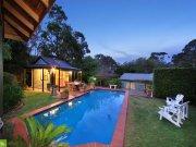  22 James Road Mount Kembla, NSW, 2526 Thoughtfully designed with a functional floor plan providing multiple spacious living areas with the family in mind. This immaculate home is situated in a prestigious and quiet pocket on a stunning manicured 1012m2 block and is within a short walk to the school. Upon entering you will be impressed with the ambience of space, elegance and exquisite period detailing. This quality home offers a large formal lounge and separate formal dining areas, family room, sunroom/rumpus, meals area as well as accommodating 5 double sized bedrooms, study and sun drenched deck. 