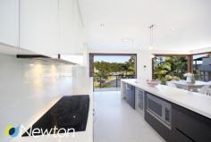 20 Bruce Ave Caringbah South NSW 2229 SUMMER BY THE BAY Privately
 positioned in a tranquil leafy setting with beautiful views across Port
 Hacking, this impressive tidal waterfront home has been designed with 
the modern family in mind. Three separate living areas include a 
dedicated home cinema, a spacious open lounge / dining flooded with 
natural light and self contained entertaining zone on the lower level 
that lends itself to the possibility of guest / In-law accommodation. 
Floor to ceiling timber bifold doors on both levels take full advantage 
of the stunning vista and allow a seamless flow between indoor and Al 
Fresco living spaces. Completing this enviable lifestyle package is a 
resort style pool with entertaining terrace and easy access to the 
waterfront facilities including storage area, ramp and electric winch. KEY FEATURES     Ample off street parking     Boat ramp and winch     Home Cinema Room     Private Tidal Waterfront     Resort style entertaining     Self contained rumpus