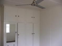  174 Macalister St Murgon QLD 4605 3 bedrooms, modern built in kitchen with stainless steel appliances, large family rumpus room. Separate lounge with air conditioning. Good paintwork and floor coverings. Ceiling fans. Bathroom has a bath and separate shower, toilet separate. Double lock up garage with store room at the rear. Separate garden shed. Fully and well fenced. Town and tank water. Tiled roof. Currently tenanted at $220 pwk, lease runs to December 2014. 