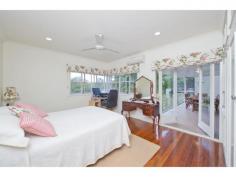  30 Nindethana Street Indooroopilly QLD 4068 PROPERTY FEATURES + This character filled 1960's double storey home is perched on the elevated high side of Nindethana Street, surrounded by prestige properties and captures the cool breezes and the fabulous leafy views. + A great family home offering an extra bonus providing a self contained unit with a separate entry, perfect for a teenager's retreat, guest accommodation or perhaps a second income rent it out. + Four generous bedrooms with built-in cupboards plus three bathrooms spread over two levels and a separate laundry. + Spacious open plan living and dining areas with polished hardwood floors, air-conditioning and an open fireplace. + Immaculate kitchen with an abundance of cupboard space. + The huge entertainer's balcony enjoys the views. + Internal stairs flow to the self contained unit plus a double lock up garage. + Quiet leafy street, good neighbourhood, flat backyard, 645m2 grounds child and pet friendly. + Water tanks, perfect north aspect. + Easy access to Indooroopilly shopping town, transport, Toowong Village, eateries, coffee shops, restaurants and the CBD. + This property offers many choices, live comfortable as is, renovate, or remove and build your dream home in this blue chip location of Indooroopilly. 