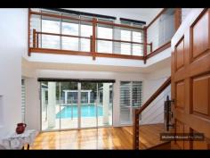  4 GAYNA STREET, KENMORE EXECUTIVE POOLSIDE ENTERTAINER Busy professional families will adore this modern feel and generous size of this special two level residence located in a secluded cul de sac.  The convenience, so close to shops, buses, schools and ability to commute north and south of the CBD makes this a perfect family option.  Designed with the pool as the central showpiece and loads of glass to capture cross breezes and natural light.  With 2 large bedrooms upstairs separated by a breezeway and adjacent to the third bathroom. While the main suite with ensuite and generous walk in robe plus fourth bedroom near the second bathroom is on the ground level.  The home office is a superb size and well located.  The large lounge and dining can be separated from the other lounge. It also leads out to the poolside patio and looks to the trees on the other side.  The beautiful kitchen is exceptionally spacious and has raked ceilings, island bench, rich timber floors and is open to the large family room and casual meals area.  There is a private covered deck on one side and more sliding doors leading to the entertaining area with high umbrella.  There is loads of storage plus a 3 car lockup garage straight in from the street.  Great value and immaculate presentatioD