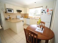  15 Binalong Street, Dalmeny NSW 2546 Immaculate three bedroom home with renovated bathroom and kitchen. Two x large garages, covered BBQ area, fully fenced yard and access from 2 streets. A nice flat block and easy walk to the sports ground and bowling club. Move on in and start relaxing!! 