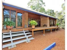  This 3 
bedroom 2 bathroom rammed earth, cedar and colorbond home is beautiful, 
functional and environmental and takes bold steps in sustainable living.
 Built with an enviromental commitment with materials to complement the 
Hills setting. The modern design incorporates clean lines, 
generous spaces, high ceilings, thicker and tinted glazing, polished 
concrete & jarrah flooring and is solar passive. Architect designed in 2003 it has many features such as:- North facing passive solar design Superior internal finishes Solar panels Solid internal doors with Italian door handles SHWS Slow combustion wood fire that heats the water Ceiling fans with Winter & Summer setting Granite bench top in the kitchen with European appliances Taps fitted with ceramic disks for saving water Termimesh Undercover entertaining area with deck Double carport Separate storeroom with built in shelves Separate spacious rammed earth studio with water & power Native gardens Insulation Environmental septic system with no concrete leach drain All this is set on a 1 acre healthy bush block in a cul-de-sac and close to local shops and public transport. To view this amazing home please contact Nathalie on 0414 644 972 Hide Full Description improves the quality of all images on this page.