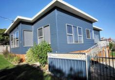 13 William St Devonport TAS 7310 This recently renovated 120 M2 three bedroom dwelling is situated in an elevated position with good quality views, secure open yard and a double length lockable garage. The practical kitchen is fitted with gas and electric cooking appliances along with a breakfast bar, plenty of storage and bench space for the chef in the family. A large dining area is open plan to the kitchen and living rooms with features of polished hardwood flooring along with many tinted windows, adding natural light and warmth to these rooms while for cooler times the Riannai Convector 404 is used. Two double size bedrooms have floor to ceiling built-ins while the smaller suitable for a child, study or office along with a functional bathroom and laundry with extra storage plus a second toilet. The northerly facing sundeck is ideal for a drink during the day soaking up the sunshine while the ramp leads to the garage and back yard. The clean and open yard may well be suitable for a Caravan, RV, Boat, Trailer or equipment with scope for a veggie patch. This property is 667 square metres, close to schools, TAFE College, shopping facilities with a short commuting time to Sea or Air travel and may well suit the first home purchaser, young family or those wishing to downsize.