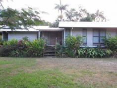  489 Gorge Road FINCH HATTON Qld 4756 Live in a lush tropical paradise amongst the rainforest in this beautifully set 5 acre property with permanent running fresh water stream and tropical low maintenance gardens. Listen and watch the running water cascade over the rocks and stones while you relax on the large under cover timber deck. This home is in excellent condition and includes 4 good-sized bedrooms, 2 with built-ins and main with W.I.R. and ensuite. Also includes a separate office and large open plan living/ dining area. The well appointed kitchen features stone benchtops, gas oven and 5 burner cooktop, dishwasher and pantry. This all opens out to the large, covered entertaining deck area. The eco friendly design boasts extra large eaves with excellent ventilation, solar hot water and solar electricity, ceiling fans and split system air-con to living and main bedroom. Two large water storage tanks and a double bay shed are also included with this property. Call for your inspection. 