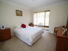  15 Binalong Street, Dalmeny NSW 2546 Immaculate three bedroom home with renovated bathroom and kitchen. Two x large garages, covered BBQ area, fully fenced yard and access from 2 streets. A nice flat block and easy walk to the sports ground and bowling club. Move on in and start relaxing!! 