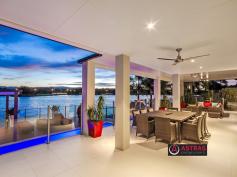 68 Montevideo Dr Clear Island Waters QLD 4226. As far as prestige properties in Clear Island Waters go, this architect 
designed 6 bedroom plus media home is not only the newest, being only 3 
?? years young, but has a vastness of value surpassed only by its 
waterfront luxury and liveability. 

 

Featuring a modern design with grand spaces and a breathtaking outlook, 
this gorgeous home occupies a prime 1,069m2 allotment especially 
selected for its size and wide water views. 

 

This two storey mansion has four separate living areas plus the media 
room, stunning generous bathrooms with square set cornice, a commercial 
gym occupies one living area, while the other three living areas, two 
downstairs and one upstairs separate the formal from informal. 

 

A modern Caesarstone kitchen with butlers pantry and stainless steel 
appliances, centre the home. A huge outdoor entertaining area 
overlooking a fully tiled pool with waterfall and LED lighting. 
Additional separate gazebo and timber decking add the finishing touches. 

 

An as new buying opportunity awaits the astute purchaser in one of the 
Gold Coasts thriving residential precincts, Clear Island Waters. 

 

??	Two levels of generous living 

??	Master suite with a dressing room the size of a bedroom 

??	Huge ensuite with twin vanities and huge spa with TV 

??	Modern stainless steel kitchen and butlers pantry 

??	State of the art smart lighting (Dynalite) 

??	Additional gazebo area 

??	Ducted vacuum system, laundry chute 

??	Fully tiled pool with waterfall 

??	Extensive timber decking 

??	Fully ducted reverse cycle air-conditioning 

??	31mtrs of wide water frontage 

 

ISLAND QUAYS 

This home is centrally located within the Island Quays estate of Clear 
Island Waters. Neighbouring Broadbeach Waters, Carrara, Mermaid Waters 
and Robina, here you can have easy access to quality schools including 
St Vincents Primary School, All Saints Anglican College, Somerset 
College, Robina State Primary & High School all within 5 minutes 
drive away. 

 

Shopping is abundant with Robina Town Centre, Q Super Centre and Pacific
 Fair all only within 5 minutes drive. You can be on the M1 motorway or 
the Train in Robina within 5 minutes, by car. 

 

An abundance of waterfront activities available, including boating, jet 
skiing, paddling, fishing, and canoeing, from the convenience of your 
backyard. The lock and weir system gives you access to Main River and 
the Broadwater with the benefit of a non tidal freshwater lake and the 
best part - no pesky sand flies/midgies! 

Broadbeach is only a 5 minute drive down Hooker Boulevard, so you can 
see why it is so convenient to live in Clear Island Waters.