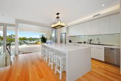15 The Lambeth Walk Bundeena NSW 2230 The Ultimate Beach House From
 the moment you enter and see the stunning water feature at the front 
door, you know this brand new home been designed for ultimate glamour 
and lifestyle. The three levels hug the cliff-face providing northerly 
water views from almost every room. Watch the property video to really see how special this house is. From
 the huge open plan living and dining area you'll be drawn to the focal 
point of this amazing home - the covered terrace with 180 degree views, 
outdoor kitchen and glass balustrades. Downstairs, the master 
suite has walk in robe, extra built-ins, ensuite and private balcony 
overlooking the water. The guest room also has a luxurious ensuite and 
built-in robes. On the ground floor there's a games room with 
space and lighting for a full sized billiard table, a wet bar with tiled
 feature wall, as well as extra storage and the laundry. From the
 level lawn, there's direct access to Gunyah Beach via your private 
sandstone staircase. Boat moorings are possible, dependant on 
availability. Key Features: Kitchen is fitted with 80mm 
Caesarstone benchtops, European appliances including induction cooktop 
with induction wok, huge island bench, Schock sink, butlers pantry and 
glass splashbacks Technology - energy-saving recessed LED lighting, 
zoned Sonos system throughout the house, zoned ducted air-conditioning, 
data and Foxtel ports in almost every room, video security intercom with
 units on all three levels. Remote control external shutters on the western windows Built-in combustion fireplace and surround sound in the lounge area Floors are secret-nailed Southern Beech, sandstone used throughout for capping, garden beds and feature walls Ground floor games room has ceramic feature wall, bar area, cedar ceilings plus laundry and extra toilet Landscaped backyard features a hot and cold outdoor shower, stairs to the beach and storage for personal watercraft Rainwater tanks and gas fittings throughout for heating The
 satisfaction of living and entertaining in this home is second to none.
 If you'd like to experience the ultimate beach house, call me to 
arrange a private viewing.