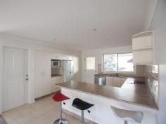  Bermagui   NSW   2546 A high quality 3 bedroom ensuite home with great street appeal, plus additional boat/caravan garaging. A sunny and spacious open plan design features a split level living space at one end, that adds interest and variety to the design. At the other end sits the kitchen with stainless steel oven and ceramic cooktop, and access to a paved rear patio. The living space and front verandah enjoys northerly views over the surrounding area with ocean glimpses in the distance. As well as a double garage with internal access to the house, there is a detached metal garage with extra high clearance especially for boats or caravans. 