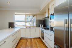  20 Clifton Gardens, KALLAROO 6025, WA **GRAND OPENING THIS SUNDAY 17th Aug 12.30 – 1.15pm**.. ……** FOR SALE
 XPRESS: All offers presented Tues 26th August at 7pm**……..Set on an 
expansive 1,012sqm block in a quiet cul-de-sac, this 5 bedroom, 2 
bathroom plus study immaculately refurbished family home boasts 
captivating Indian ocean views from the upstairs balcony. 
Step inside to gorgeous marri floors via the double door entrance, 
leading through to the generously sized home office that could be used 
as a sixth bedroom. The expansive master suite is fit for a king and 
queen and comes complete with WIR and stunning new bathroom complete 
with stone bench tops and double basins, double shower with gorgeous 
glass splashback and overhead rain shower. 
Make your way through to the hub of the house with open plan 
kitchen/dining/living overlooking the outside alfresco area. The gourmet
 kitchen is sure to impress any budding master chef and features stone 
bench tops, glass splashback, soft closing drawers with oodles of 
cupboard space, top of the range appliances including a Miele dishwasher
 and Technika stainless appliances including an in-built coffee maker. 
Meander outside to the timber lined alfresco, massive pool with plenty 
of space for the kids to play and gazebo area with barbecue. The kid’s 
wing features 3 double bedrooms that are all bigger than many master 
suites. All come complete with fitted out BIR with a second renovated 
bathroom, again with stone bench tops, shower and bath with a unique 
glass splashback featuring Where’s Wally and Nemo. 
Upstairs you will fall in love with the theatre/games room with 
fantastic bar/second kitchenette area with a gorgeous solid jarrah top, 4
 integrated temperature controlled bar fridges, sink with hot and cold 
water, built in shelves, glass splashback and theatre projector screen! 
Featuring a guest bedroom upstairs with stunning views you simply can’t 
go wrong! Ideally located in walking distance to St Marks Anglican 
School, Whitfords shopping centre, Whitfords beach, the local Montague 
Park with play equipment, Hillarys boat harbour and Mullaloo beach a 5 
min drive and easy access to the Mitchell freeway you won’t be 
disappointed. 
 Other features include 
-	Ducted reverse cycle air conditioning 
-	Neutral carpets and colours throughout 
-	Formal lounge and dining area 
-	Monitored Alarm system 
-	Huge double remote control garage with room for 2 cars and a jetski 
-	Reticulation throughout 
-	Room for parking boat/caravan 
-	Gas hot water system 
-	4 bedrooms located downstairs with guest room upstairs 
-	Extra storage in roof 
- 
Automatic roller shutters to front of house and en suite 
- 
Insulation throughout 