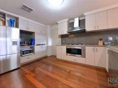 1D Young Street, Melville WA Home Open:  Sat, 16-Aug-2014, 11:30am - 12:00pm The exceptional alfresco area and very chic kitchen/dining/living of this outstanding rear home takes entertaining to a whole new level! Cook and dine alfresco in real style. A built-in BBQ/outdoor kitchen with stainless steel topped benches, splash back and hood; in-built bar fridge, plus timber faced cabinets, perfectly co-ordinated with the cedar lined ceiling above, will impress. Be equally proud entertaining from the chic natural toned kitchen, with hi-spec stainless steel appliances, lattè tinted glass splashback; toning stone top benches, servery and breakfast bar; backed up with a large walk-in pantry for all your gourmet goodies.  Front double entrance doors invite guests into a recessed ceiling enclosed vestibule, with a home office/study (or 4th bedroom) to one side. Opposite, steps lead down to a generous master bedroom; a central passage to the stunning ensuite divides his and her walk-in robes. Similarly, steps lead down to the family wing off of the living area, with two double sized bedrooms, family bathroom, private toilet, laundry with built-in cabinets and an extra large walk-in storeroom.  Polished jarrah floorboards feature throughout indoors. Outdoors, the alfresco, driveway and paths are limestone paved. Included are timber blinds, loads of built in storage, double remote control garage with service entry, alarm system, electric entrance gate, water feature, ducted reverse cycle air conditioning, plus lots, lots more. On a 562sqm Green Title block, in a leafy, sought after street, this home is distinctively impressing. 