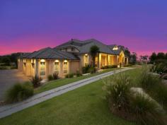 38 Portrush Crescent Luddenham NSW 2745 Live Like Royalty! It has to be seen to be believed! This huge 5 bedroom home overlooks the stunning 6th green of the Graham Marsh designed Twin Creeks Championship Golf Course. Each bedroom features it's own ensuite, extravangant living is an understatement! The large kitchen with only the best appliances & gas cooking combined with al fresco dining is ideal for entertaining your friends & family, overlooking the superb solar heated swimming pool with wet edge & vineyard environment. The integrated indoor / outdoor audio sound system makes entertaining a breeze, with a wet bar and cellar taking care of the fussiest coinnoisseur. Ducted air conditioning, 4 garage spaces, 2 golf memberships included! There are too many features to list and must be inspected to view all that this beautiful masterpiece has to offer. Call Moses on 0402 693 231 or 9687 5188 to arrange an inspection to view this masterpiece. 