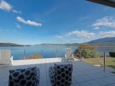 5 Koluri Court, LINDISFARNE, TAS 7015 Commanding spectacular 
views of the River Derwent, over to the Western Shore and back to the 
Eastern Shore this expansive family home is the ultimate waterfront 
abode. Nestled away in an exclusive enclave in Lindisfarne surrounded by
 other prestige homes this two storey home sits on a large block 
fronting a wide expanse of quiet river frontage - a unique and special 
offering. This residence has been home to the current owners for 
over 26 years, meticulously built and perfectly maintained and upgraded 
over the years it offers a versatile floor plan with a multitude of 
entertaining options and ambient living. On entering this magnificent home the family/dining room leads the large entertaining deck where
 superb waterfront views will amaze. The adjacent thoughtfully upgraded 
kitchen boasts quality appliances and combined with this large family 
room offers a perfect area for entertaining. This level is also host 
to a large formal dining room and sunken living room where light and 
space abounds - and offers comfortable living for all family members. A
 large second entertaining area or games room complete with bar and TV 
room on the main level leads to the expansive outdoor entertaining area 
complete with large in ground solar heated pool. There is also another 
bathroom with shower providing good amenity for the pool area nearby. The
 accommodation of the main house is set on the upper level and offers 4 
bedrooms, all with built in robes and a large family bathroom with 
separate spa bath and shower. Wake to the many moods of Mount Wellington
 across the River Derwent with the luxurious master bedroom complete 
with balcony, walk in robe and ensuite. This home is warm in 
winter with multiple heating options including a large open fire place 
in the formal living room, heat pumps, panel heaters and also a wood 
heater to create a beautiful atmosphere in winter from the family room 
overlooking the water. Downstairs there is a large 2 bedroom self
 contained flat with a large living/dining area separate kitchen and 
laundry. Two large bedrooms with built in robes and a central bathroom 
complete this great package. The outdoor terrace area is perfect for 
privacy from the main house and an automatic garage for this flat offers
 secure parking. Set on an easy care, child-friendly lawn with 
level access to the main residence and the 2 bedroom self contained unit
 this property is suitable for all types of buyers. Whether you want a 
large family home with an income producing unit or for older members of 
your family, extended family or a teenager at University - the 
possibilities are endless. Other features include: Double remote 
garage, additional off street parking, mere minutes walk to Lindisfarne 
Village, the walking tracks, sports grounds, local restaurants and 
cafes. Located a mere 10 minute drive to Hobart CBD and 15 minutes to 
Hobart International Airport. A luxurious, enviable lifestyle is on offer to those wanting privacy, waterfront position and convenience. Land Area : 1423 sqm Floor Area : 478 sqm 