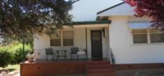  15 Cnr Fisher & Medlyn Streets Parkes NSW 2870 Well cared for home with 2 main bedrooms plus 3rd/sleep out, separate lounge and dining off kitchen, garage positioned on a 1426sqm block subject to C.A. should be able to create separate vacant building block of approx. 810sqm. This presents a great start to live in the home and build your home later! 