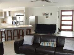  5-7 Blueberry Street Banksia Beach Qld 4507 OLF COURSE ESTATE QUALITY LIVING BELOW BUILD COST This four bedroom golf course estate property is a must to view. The property offers huge side access for caravan, boat or trailer and room for a pool. Add to this ducted air conditioning, media room, all bedrooms are large with built ins and 9 feet ceilings throughout. Outdoors entertain on your large timber entertainment deck.  