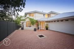  84B Basingall Street East Victoria Park WA 6101 ucked away at the end of a long, plant-lined driveway, this contemporary two-storey home has a grand, limestone brick facade and is surrounded by low-maintenance planting, giving it a clean, Mediterranean appeal. Built in 2001, it has been beautifully maintained by its current owner - there is nothing to do except move in.  The house is freshly painted in neutral creams throughout, with quality drapes, elegant light fittings and split-system air-conditioning in all the bedrooms, and brand-new wool carpets on the first floor. It's flooded with natural light throughout the day, and benefits from beautiful views of the surrounding landscape from the first-floor balcony.  The front door opens into a grand entrance, with steps through an archway leading down into a spacious open-plan living room with gas fire, cream tiled floors and high ceilings. The dining area looks out over the back garden, and the generous kitchen has a moveable island bench, walk-in pantry and ample storage.  The reticulated, easy-care back garden has a large limestone-paved terrace and is filled with rose bushes and citrus trees, as well as a beautiful water feature. It's a lovely, quiet spot for a barbecue or glass of wine in the evening, and benefits from the tranquillity of neighbouring gardens.  The ground floor also has a large guest bedroom with a walk-in robe, views out to a water feature, and an adjacent white-tiled bathroom.  Upstairs, a smaller living room with a sink and space for a bar fridge is perfect for curling up on winter nights. A huge balcony is one of the owner's favourite spots for breakfast, offering panoramic views towards the hills and over the surrounding trees and gardens through wooden venetian blinds.  A beautiful main suite benefits from the elevated views, and features a large ensuite with a dressing room/walk-in robe. Two more bedrooms, one with another walk-in robe, complete the first floor.  As well as being beautiful, the house is very practical, with a ducted vacuum system, a double garage/laundry with its own entrance the house, and an attic space for storage over the garage.  The home is well positioned yet private and set back from the road: just four kilometres from the CBD and close to schools, Curtin University, the causeway and the Graham Farmer Freeway. There's also a local shopping centre and library down the road, as well as the restaurants of Victoria Park on your doorstep.  