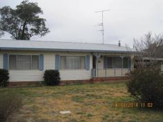  16 Knight Street Coonabarabran NSW 2357 Well maintained cladded home close to schools and hospital. 3 bedrooms and 2 have built in wardrobes. Kitchen has a new stove and vinyl flooring. Seperate dining room with sitting room and walk in pantry. Lounge room has R/C A/C and wood fire. Older style bathroom has bath, shower, vanity and toilet. Laundry and office area are accessed from back verandah. Lock up garage, carport, garden sheds and outside toilet. Large block with rear lane access. 