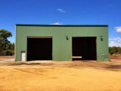 39 Fishburn St Cowra NSW 2794  The property is in an I2 Zone and has further development potential. A
 level, well fenced block in Fishburn St (a popular area for Light 
Industry), offering 1.88 HA (4.6 acres) in area & comprises a 93m 
frontage & 200m depth with 2 access points. Power, Phone and Water 
are available. Main shed constructed of steel frame and colorbond
 cladding and roof. It has a concrete floor, 3 large roller doors and 
one PA door. Adjoining this shed is a built-in weighbridge. 2nd shed is 
used for an office / staff area and is also colorbond construction. 
There is also an amenities modular building. (shower, hand basin, 
toilet) Call for more details. 0418 699080 Wayne Heilman   Property Snapshot Sale Price: By Negotiation Building Area: 250 m2 Site Area: 2 ha Property Type: Light Factory Uncovered Parking: 10 Total Parking: 10 Features: Container Access Heavy Vehicle Access Shower Vacant Possession Vehicle Access 