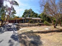  88 CONNELL AVE   Martin   WA   6110 HOME OPEN CANCELLED LIVE AMONGST THE GUM TREES  Set in a sought after location on elevated 1,969 m2 corner block. This solid brick & tile construction home consists of 3 bedrooms, 2 bathrooms and 2 separate living areas.  The theatre room has french doors leading out to front of the house, open plan combined living / dining area and the rooms facing the stunning views from the front of the house. FEATURES : * Country style kitchen, with range hood and built-in wine rack and solid timber doors * Evaporative air-con through out, gas heating in the front lounge and gas HWS  * The master bedroom has plenty of cupboard space with large BIR. Bedroom 2 has a study nook and BIR and both rooms have panoramic views. * Bedroom 3 also has great view of the rear yard and a separate en-suite bathroom  * Large double work shop with separate drive way, as well as main drive way to the front of the house. Side access to the gabled patio area which can allow for additional parking space. This property gives absolute tranquility with stunning views throughout most rooms as well as the great outdoors. The large gable patio area has a featured ... show more View Sold Properties for this Location View Auction Results General Features Property Type: House Bedrooms: 3 Bathrooms: 2 Land Size: 1969 m² (approx) Indoor Features Built-in Wardrobes Evaporative Cooling Ducted Cooling Outdoor Features Secure Parking Outdoor Entertaining Area Shed Floorplans & Interactive Tours Details not provided 