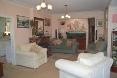 2 Lynches Road - Sue Ross Real Estate GuyraA delightful south-side character home that seamlessly combines modern living and traditional features. Set on a fully fenced 3.31 acre corner block, the home is located in the highly sort after South Hill area. The home is surrounded by established cottage gardens that provide a number of nooks to relax in. The
 covered front landing leads into the lounge which has a lovely wood 
heater that keeps the home toasty warm on cold days and nights. This
 flows through to a combined dining and kitchen area. The kitchen is 
beautifully appointed with Caesarstone benchtops, extra wide stove with 
ceramic cooktop, dishwasher, ice maker refrigerator and oodles of 
storage. The master bedroom includes a beautifully appointed ensuite with spa bath, built-in wardrobe and garden views. Features include: 4 bedrooms 3 bathrooms 2 living areas Study/Office As new galley kitchen Sewing nook Several outdoor entertainment areas Rear timber deck Wood heating RVC air-conditioning Single garage Large workshop Several garden sheds Chicken run Tranquil surrounds Large 3.31 acre fully fenced block Council approved subdivision potential The
 new owner will also appreciate the quiet, friendly nature of the 
neighbourhood, the welcome privacy, the lack of noise pollution often 
associated with higher density living areas and the easy access to the 
CBD. Vendors are on the move so don’t delay with your interest! 