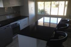  46 Davey Street, Moura This home displays a modern functional kitchen, comfortable lounge, 3 spacious bedrooms with built-in cupboards, fans, air conditioning and carpet. Front decking and side under covered entertainment area. Colour bond fenced back yard with double gate side access. Newly erected 3 bay shed with one bay built-in for storage. Landscape gardens. This family home has been renovated completely inside and is looking for someone to make it home. 