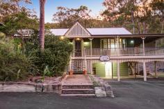  9 Warrandyte Court Camp Mountain QLD 4520 Position is a key feature that differentiates this property from others in the Samford district and indeed acreage properties in Brisbane generally. Only 7 mins to Ferny Grove train station means transit to the city centre and events is easy and quick. Driving time is only 30 minutes to the city. Uniquely situated at the base of Camp Mountain, bordering the D'Aguilar National Park, with nature trails right at your doorstep, lies this hidden gem on 3.75 acres. Privacy is paramount and the new owners will enjoy a chilled and relaxed lifestyle with the assets that abound.  A recent extension by Garth Chapman Queenslanders has created a large 6.8 x 6.5m outdoor pavilion. Such a beautiful space, it has everything you need for entertaining in style built in seating, BBQ with stone bench tops, storage areas and tv points, ready for your widescreen TV. Take 2 steps down from the pavilion and you are in your massive, granite paved sparkling pool area with semi frameless glass fencing, hot water outdoor shower, beautiful water feature and a pump room that is impressive in itself, allowing convenient storage for chemicals, pool toys etc. This will be a place you will be very proud to entertain from.  Adjacent to the pavilion area is the kitchen has had a recent update whilst retaining its farmhouse kitchen styling, with stone bench tops, step in pantry and quality 900mm Smeg freestanding oven and gas cooktop. Large windows open out to a servery, and are conveniently positioned to make entertaining a pleasure.  This majestic north facing Queenslander has 15 foot vented timber ceilings and careful window and silky oak French doors to the wide verandahs. This home is very cool during the summer months and with the use of the ceiling fans has no need of air conditioning.  The family room features a brick open fireplace, ensuring many winter months enjoyed by the warmth of the fireside. The bedroom wing has of 4 bedrooms, 3 of which have new built in wardrobes with custom shelving. These all open out to a rumpus area with floor to ceiling sliding doors which open up to allow further breezes to flow through. The master bedroom is spacious and features a large walk in robe and ensuite with sunken spa bath and sash windows that can be opened up to enjoy the views while soaking the day away.  Downstairs, a recently built 6m x 6m office is perfect for those who work from home with its separate entrance, but could be used as a teenage retreat or media room perhaps? The owner has taken advantage of the lands natural drainage, which allows water to flow to the dam with pumps for irrigation to the gardens and a total of 80,000 litres of water storage ensures you should never run dry. 