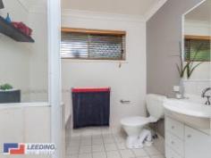  7 Penleigh Boondall Qld 4034 Privately located at end of a quiet cul-de-sac adjacent to acres of beautiful parklands this modernised, low maintenance, family friendly home is situated in arguably one of the best positions that Collage Green has to offer. The master bedroom is a parents retreat, positioned at the front of the property overlooking the beautifully maintained gardens and paved courtyard. It offers a private en suite and large mirrored built in robes. The other 2 bedrooms (both with built in robes) lead to the separate tiled family room at the rear of the home. At the centre of the property is the functional gallery styled kitchen with gas appliances and a large breakfast bar that leads to the L shaped lounge and dining rooms with polished bamboo flooring. The main bathroom comprises of a separate bath and shower and features ample built in storage. The fully ducted air conditioning throughout the home makes it comfortable all year round. Outside is what really sets this home apart from the others. The double side access leads to one of the huge skillion roofed areas that has the ability to house the largest of boats or caravans. This combined with the remote controlled double garage with direct internal access to the home offers a total of 4 car undercover accommodation. At the rear of the property is the second even larger undercover area, flanked by tropical palms and frangipanis it is the most ideal alfresco area. With both areas fully insulated and wired for surround sound, this property can house the largest of family functions. If entertaining is not for you, then sit back and enjoy a glass of wine (or 2!) in your heated 6 person hydrotherapy spa overlooking the tranquil parklands, listen to the wildlife and RELAX! Positioned within walking distance to both primary and secondary schools and to Boondall train station. With easy access to the Gateway Arterial road and just a short drive to 3 major shopping centres you will be hard pressed finding a home with this many features in such an idyllic serene location. This is not your average home- you must inspect to appreciate. 