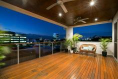  25 Aston Street, Toowong, QLD, 4066 Quality at its finest, this architectural designed home showcases light filled interiors, cross ventilation and premium quality finishes. Set on an enviable 1012sqm the home captures elevated views across Toowong to the river and city, an exclusive address just footsteps from prestigious schools, Toowong Village, trains, buses and the Ferry. No expense has been spared on this remarkable family home. •	Striking tri-level family residence •	Luxurious master suite with dressing room, ensuite and private terrace •	Five oversized bedrooms, four with ensuites and all with walk in robes •	Sleek gourmet kitchen with marble splash back and stone bench-tops, European appliances and butler’s pantry •	Floor to ceiling glass open to due north aspect at the rear •	A desirable low stress lifestyle is yours to be enjoyed •	Terraced entertaining decks, landscaped gardens with magnificent, mature trees •	Media room, adjacent to casual living, is the gate-way to a resort style pool area •	Perfect north/east aspect offer chic interiors flooded with light •	Three car garage, ample storage and air conditioned wine cellar •	15 minutes or less to the Brisbane CBD, Golf Courses, UQ, QUT 