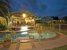 45 Atkinson Dr Karana Downs QLD 4306 SENSATIONAL ENTERTAINING HOME ON THE RIVER 
 Looks can be deceiving, from the front of this property, you cannot 
imagine the size of this family home. Private front gardens lead to a 
double carport with remote control garage door with an added covered 
area for the boat or campervan. Security screens all round and really 
nothing to do but move in and make this house your home. 
 Upon entering, to the left is a lovely formal lounge area which then 
flows through to a huge rumpus/bar room with an air conditioner for year
 round comfort. Sliding doors on adjacent walls allow for the breezes to
 flow through and easy access to the front of the house or the fantastic
 shaded area. 
 To the right is a private parent suite, a good size bedroom, 
beautiful en-suite with double shower, double vanity and a massive 
walk-in wardrobe / dressing room. 
 As you walk down the hall into the kitchen living area, money has not
 been spared on these appliances. Top of the range gas cook top, a cooks
 dream with a double oven and near new dishwasher. Plenty of cupboard 
space, with an appliance cupboard and two pantries. Beside the kitchen 
is a room that can be closed off and used for what-ever you want, 
previously an office but can be used for anything. The hub of the home 
is the kitchen, and there is plenty of space for the family dining and 
living area adjacent to the kitchen. 
 There are another 3 bedrooms, and great insight by the current owners
 to put a separate vanity, separate toilet and separate bathroom, this 
truly is a fantastic family home. With ceiling fans and quality lighting
 throughout. 
 If you thought inside was good, wait until you see the outside 
entertaining areas. There is not only the huge shaded area, but an 
insulated outdoor area, that can be enclosed for all seasons, so you can
 have your gas heaters going in winter, and open it up for the river 
breeze in the summer. As well as this room, there is a great covered 
deck overlooking the lovely in ground pool, with a sink and cupboards as
 well as room for a fridge and or oven. All this outdoor entertaining 
area will provide the room for the biggest of family gatherings. 
 A gentle terraced path leads down to a huge flat area, where the kids
 can play football or cricket and this ends at the Brisbane river. What 
more could a family want? 
 Words are not enough to describe this property, only an inspection 
will truly show how fantastic this home is. You don’t want to be the one
 to let this get away, call Linda for an appointment, you will not be 
disappointed. Listed at $598,000 this property will not last long on the
 market. 