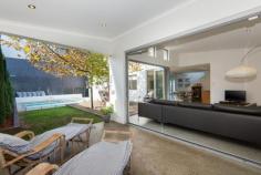 1B Cadd Street,	
	BEACONSFIELD WA 6162 This stunning abode has it all. Contemporary design and a modern, free 
flowing layout has shaped this seamless entertaining haven. Polished 
concrete flooring sets the scene, let you senses be wowed! A 
modern, bright entry way leads into the open plan kitchen, dining and 
sitting rooms. The kitchen has been excellently designed with family 
living in mind; it has ample storage, stone bench tops and a walk in 
pantry. Featuring stainless steel D'amani electric oven, gas stove, a 
Miele dishwasher and plumbing connection to the fridge nook. The vast 
island bench also forms a breakfast bar which can seat four. Overlooking
 the sitting and dining room; you can cook dinner but still be a part of
 the action. The sitting room features a high ceiling, gas point,
 highlight windows and dramatic glass bi-fold doors which open out to 
alfresco dining area and decking. Step out into the enchanting private 
oasis where a mature plain tree provides dappled shade to the decking 
and lawn. The spacious salt water swimming pool is enclosed by a modern 
frameless glass fence. The polished concrete floor flows through to the 
alfresco dining area which features down lights and a gas point. The
 three minor bedrooms are located on the ground floor of the home and 
are all spacious well sized carpeted rooms. Each room has a built in 
robe with ample hanging space and shelving, a built in desk, ceiling fan
 and quality louvered window treatments. The second bathroom has a large
 his and hers vanity and a stunning shower over an extra deep modern 
bathtub. The laundry is another example of the brilliant design 
this family home offers. It has ample full length and normal storage, a 
tiled splash back, plenty of bench space with provision for under bench 
wash and dryer, access directly to the backyard and a separate toilet. Meander
 up the light, welcoming staircase to the exquisite parents retreat. The
 spacious sitting room has stunning views to Fremantle and ocean 
glimpses. The master bedroom is a large bright space with a sense of 
peace and tranquility. The ensuite bathroom has a roomy his and hers 
rain water shower head and separate toilet. The walk in robe is large 
and has ample hanging space and plenty of shelving. A home office nook 
with built in desk completes leads out to the private Juliet balcony. 
You can just imagine relaxing with your morning coffee while you take in
 the glimpses of the ocean and enjoy the sea breeze. This family home
 really does have it all! The location is outstanding, walking distance 
to the expansive Hilton Park, the cafes of South Fremantle, schools and 
the beach. This quiet leafy street is just far enough from the bustle of
 vibrant Fremantle to be tranquil but still close enough that you can 
enjoy all it has to offer. Other features include but not limited to: - Reverse cycle air conditioner in the main sitting room. - Sensor alarm system - Gas hot water system - Modern neutral colour scheme throughout home - Separate downstairs toilet - Quality louvered window treatments throughout the home - Large double car garage with additional storage and shoppers access to the home - Additional off street parking - Automated reticulation to all gardens   
			 