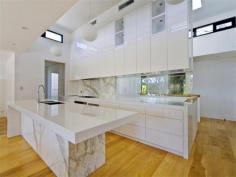 4 Awaba St Mosman NSW 2088 BALMORAL'S ULTIMATE BEACH LIFESTYLE INSPECT THIS SATURDAY 11:00am to 11:45am. Designed by acclaimed architect, David Melocco, this stylish North facing, Freestanding luxury home boasts an abundance of entertaining areas both indoors and alfresco. Situated just steps from Balmoral Beach, this exquisite home offers stunning open plan living/dining extending onto a full length outdoor entertaining area with beach side views. Ideal for those who enjoy the cosmopolitan lifestyle of Balmoral Beach and its famous eateries, this luxury residence is a rare find with a DLUG and up to two off-street parks. Just some of the other outstanding features on offer include... • North facing home with stunning open plan living/dining area & large alfresco balcony • Gourmet kitchen with marble & Caesarstone benchtops and Miele appliances • Separate rumpus room flows to entertaining deck and level lawn, perfect for children or entertaining • Exceptionally designed bathrooms featuring Italian marble • Modern living for the entertainer • Stroll to shops, cafes & transport • 4 Double Bedrooms all with built in robes, • Master suite with walk-in Robe • 2 separate living areas • 3 bathrooms • Office/study area • Upstairs storage/linen area & under stair storage area • Massive master suite with huge private balcony & walk in robe • Luxury Italian marble master ensuite with 3.5m ceilings and huge skylight • Oversized double garage + 2 secure off street guest parking spaces • Hot outdoor shower • Ducted 2 zone reverse cycle air-conditioning • Italian marble laundry room • Beautifully landscaped gardens • 220m oak floorboards throughout, high grade commercial plush carpets in bedrooms • Himalayan sandstone to exterior paths, alfresco, balcony and retaining walls