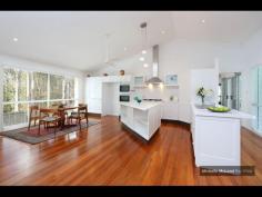  4 GAYNA STREET, KENMORE EXECUTIVE POOLSIDE ENTERTAINER Busy professional families will adore this modern feel and generous size of this special two level residence located in a secluded cul de sac.  The convenience, so close to shops, buses, schools and ability to commute north and south of the CBD makes this a perfect family option.  Designed with the pool as the central showpiece and loads of glass to capture cross breezes and natural light.  With 2 large bedrooms upstairs separated by a breezeway and adjacent to the third bathroom. While the main suite with ensuite and generous walk in robe plus fourth bedroom near the second bathroom is on the ground level.  The home office is a superb size and well located.  The large lounge and dining can be separated from the other lounge. It also leads out to the poolside patio and looks to the trees on the other side.  The beautiful kitchen is exceptionally spacious and has raked ceilings, island bench, rich timber floors and is open to the large family room and casual meals area.  There is a private covered deck on one side and more sliding doors leading to the entertaining area with high umbrella.  There is loads of storage plus a 3 car lockup garage straight in from the street.  Great value and immaculate presentatioD