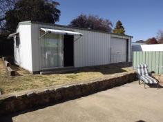  101 Church Street Glen Innes NSW 2370 For the medium price home buyer or investor - consisting of 3 bedrooms all with built ins, 2 bathrooms with toilets, front patio, spacious open plan kitchen/dining, separate living/lounge area with wood heating, gas kitchen and h/w system, laundry, plenty of linen storage cupboards, enclosed rear grassed in patio/morning breakfast, garden, concrete driveway to lock up garage, workshop, childrens play station with rear yard that is completely child & pet friendly. 