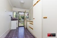  30 Winstanley Street Chapman ACT 2611 This large five bedroom, three bathroom home is located at the top of Chapman on a 1387m block with panoramic views over Canberra! The front deck is ready for the next gathering of family or friends to enjoy the vistas from this elevated vantage point. The home boasts many endearing features that a family home owner will appreciate, including; as new designer kitchen with top grade appliances, large laundry, plenty of cupboard space, two ensuites plus a renovated bathroom with in-slab heating. The list doesn't stop here though, halfway down the stairs there is a secret door to the children's craft room that even Professor Dumbledore would approve of. A home office and rumpus room are located on the ground floor along with plenty of extra storage space and internal access to the double garage with remote controlled doors. The landscaped rear garden is home to the cubby house to beat all cubby houses, including a fort, fireman's pole and sway bridge! A second garage is located to the side of the home with plumbing in place for an ensuite if desired. An easy care garden has a mix of smaller shrubs, larger shade trees and two very healthy orange trees. The orientation of the home captures the winter sunshine beautifully and in the middle of winter when the fog has set in, the odds are that you will be floating above it sharing the sunlight with Black Mountain as your new neighbour. Surrounded by homes worth well over the one million dollar mark, buyers are sure to find value on offer. • Ducted gas heating • Evaporative cooling • Rinnai instant gas hot water • Large deck with amazing view • Three bathrooms • Home office plus rumpus • Internal access from garage • Circular driveway • Landscaped gardens • Cubby house • Additional double garage 