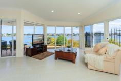  MERMAID WATERS, QLD, 4218  Summoning an immediate impression of individualism, quality and sophistication... Whilst embracing unrivalled 180 degree views of absolutely breathtaking water panorama. Evidence of architectural influence is immediately apparent as this single level home showcases floor to ceiling glass providing a seamless connection between the surrounding water and adjoining park vista. A dramatic glass skyline atrium creates a light filled haven with multiple living zones, high ceiling line and natural stone fireplace that further emphasize the sense of individuality. The home exudes a welcoming warmth whilst affording an element of freedom courtesy of its design concept that includes vast proportions, including an enormous kitchen, a separate waterside master suite, and an additional 3 bedrooms plus a separate study with the option of private entry. Set in arguably one of the most prestigious address's in Mermaid Waters with direct boating access and the added benefit of adjoining a beautiful waterfront park. Ultra convenient location within easy reach of major shopping centres, Casino, Dining, Entertainment venues, schools, public transport (including the soon to be completed light rail link) and the beach. You will be provided with an intense sense of urgency to act, as you readily identify that this property will surrender you a celebrated lifestyle in a position that has no equal. Priced to meet the market, act now! Call to arrange viewing. 