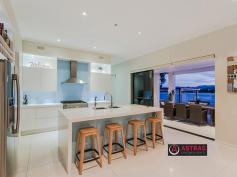  68 Montevideo Dr Clear Island Waters QLD 4226. As far as prestige properties in Clear Island Waters go, this architect 
designed 6 bedroom plus media home is not only the newest, being only 3 
?? years young, but has a vastness of value surpassed only by its 
waterfront luxury and liveability. 

 

Featuring a modern design with grand spaces and a breathtaking outlook, 
this gorgeous home occupies a prime 1,069m2 allotment especially 
selected for its size and wide water views. 

 

This two storey mansion has four separate living areas plus the media 
room, stunning generous bathrooms with square set cornice, a commercial 
gym occupies one living area, while the other three living areas, two 
downstairs and one upstairs separate the formal from informal. 

 

A modern Caesarstone kitchen with butlers pantry and stainless steel 
appliances, centre the home. A huge outdoor entertaining area 
overlooking a fully tiled pool with waterfall and LED lighting. 
Additional separate gazebo and timber decking add the finishing touches. 

 

An as new buying opportunity awaits the astute purchaser in one of the 
Gold Coasts thriving residential precincts, Clear Island Waters. 

 

??	Two levels of generous living 

??	Master suite with a dressing room the size of a bedroom 

??	Huge ensuite with twin vanities and huge spa with TV 

??	Modern stainless steel kitchen and butlers pantry 

??	State of the art smart lighting (Dynalite) 

??	Additional gazebo area 

??	Ducted vacuum system, laundry chute 

??	Fully tiled pool with waterfall 

??	Extensive timber decking 

??	Fully ducted reverse cycle air-conditioning 

??	31mtrs of wide water frontage 

 

ISLAND QUAYS 

This home is centrally located within the Island Quays estate of Clear 
Island Waters. Neighbouring Broadbeach Waters, Carrara, Mermaid Waters 
and Robina, here you can have easy access to quality schools including 
St Vincents Primary School, All Saints Anglican College, Somerset 
College, Robina State Primary & High School all within 5 minutes 
drive away. 

 

Shopping is abundant with Robina Town Centre, Q Super Centre and Pacific
 Fair all only within 5 minutes drive. You can be on the M1 motorway or 
the Train in Robina within 5 minutes, by car. 

 

An abundance of waterfront activities available, including boating, jet 
skiing, paddling, fishing, and canoeing, from the convenience of your 
backyard. The lock and weir system gives you access to Main River and 
the Broadwater with the benefit of a non tidal freshwater lake and the 
best part - no pesky sand flies/midgies! 

Broadbeach is only a 5 minute drive down Hooker Boulevard, so you can 
see why it is so convenient to live in Clear Island Waters.