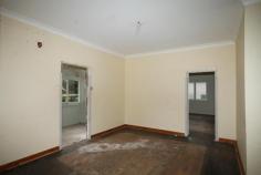  28 Penrose Rd Bundanoon NSW 2578 This home has been stripped, kicked, defaced, badly painted and generally treated very poorly before it was abandoned. It is saveable, but is in need of considerable work and repair. It consists of an eat in kitchen, 3 bedrooms, a large entry foyer and a wide rear verandah that offers a good local outlook. There's also a good freestanding double metal shed. The land is about 1400m2 in an excellent location location location within easy walking distance of the shops, school and station. Work required includes a kitchen, bathroom and laundry, some carpentry plus paint and floor coverings. Construction is weather board (since vinyl clad) with a metal roof and timber floors. 