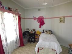  101 Church Street Glen Innes NSW 2370 For the medium price home buyer or investor - consisting of 3 bedrooms all with built ins, 2 bathrooms with toilets, front patio, spacious open plan kitchen/dining, separate living/lounge area with wood heating, gas kitchen and h/w system, laundry, plenty of linen storage cupboards, enclosed rear grassed in patio/morning breakfast, garden, concrete driveway to lock up garage, workshop, childrens play station with rear yard that is completely child & pet friendly. 