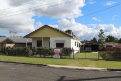  3 George St Cessnock NSW 2325 This neat and tidy home is located in a quiet well established street close to Cessnock CBD. 
The home features 3 generous sized bedrooms, living area with ceiling 
fans and air conditioner, dining room with ceiling fan and gas fire, 
older style kitchen with electric stove and dishwasher, huge laundry and
 a large enclosed sunroom at the rear of the home. 
The low maintenance yard is level and fully fenced and the property 
boasts an oversized double garage as well as a carport for 4 vehicles. 
An added bonus are the solar panels so you can generate your own electricity and save on those power bills. 
This is a great property for those looking to enter the property market 
 as well as those looking to downsize. Donâ€™t miss this one! Contact 
Chris Mallik of Mallik Real Estate now on 49915234 or 0467448531 for 
further information and to arrange a private inspection. 