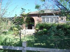 4067 Mid Western Hwy Blayney NSW 2799      A Piece of Blayney's History on 79 Acres One of the Marsden's homes "Boomanulla"is set on 79 Acres up high overlooking Blayney, a 1930's double brick, Art Deco style home with beautiful established gardens and trees and has retained many of its original features. There is a beautiful entry hall with polished floors and original cedar doors and architraves. It has a spacious lounge, with wood heating, lovely leadlight windows and French doors leading into a light and airy sunroom. The dining room is massive with open fire, kitchen has gas stove plus slow combustion bakers over, walk-in-pantry and plenty of bench space. There are 2 large bedrooms with ornate ceilings and one office. Water is by tank and townwater. It has an orchard with figs, mulberry's, apples, pears and walnuts, woodshed, haysheds, machinery shed, small stable, chookyard, dog yards, old set of sheep yards and an old tennis court. Features     Fireplace(s)     Floorboards     Fully fenced     Heating     Pets allowed     Separate Dining Room     Shed 2010299191 