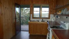  Witta, QLD, 4552 This one acre property (3917 sqm) is ideally situated, enjoying good elevation and a lovely outlook across Witta, as well as a high degree of privacy. The two bedroom timber house has loads of character with timber VJ internal walls and ceilings and polished hardwood floors. With 2 bedrooms and a single bathroom the home is suitable for a small family, couple or a weekender for the lifestyle buyer. With a full length verandah on two sides of the home, comprising new decking and balustrade, the outdoor living area takes in the view and offers a lovely aspect over the land. The kitchen and bathroom are original to the home and have been left that way for the new owner to change according to taste. With features such as high ceilings, exposed timbers, fireplace, verandah and a rolling hills outlook buyers will not be disappointed. The property is accessed by an all weather driveway which leads down to the garage, offering additional space for storage and workshop.  Rainwater storage is 8000 gallons split between two galvanized tanks. 