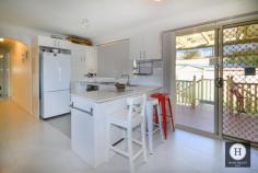  1118 Pimpama-Jacobs Well Road Jacobs Well QLD 4208 This home is rated A for Awesome! There are no compromises with this impressive home in the ever popular Jacobs Well. Enjoy your morning coffee on the wrap around verandah while watching the kids play safely in the fully fenced private yard. Or maybe take a stroll to the waterfront for some sunshine and fresh air. Kitchen, bedrooms and living areas have been recently renovated, leaving you with nothing left to do! This modern, fresh home is also energy efficient with solar panels, insulation, water tanks and recycled water. What else do you want?! Close to facilities? Got it! Walk to the local park, jetty, waterfront, shops and tavern. This location is unbeatable. Need we say more, book your inspection NOW! Features include 3 Great sized bedrooms - all with built in robes Kitchen with caesar stone benchtop Large open plan living area with plenty of natural light Bathroom with seperate toilet, vanity and shower/bath Air conditioned - reverse cycle Solar Panels Insulated 3 Water tanks Fully fenced 607m2 block Garden Shed Single lock up garage with workshop 