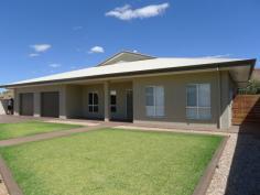  87 Albrecht Drive, LARAPINTA NT 0870 This newly built home has been designed with quality fittings, contemporary style & decor, convenience, energy efficiency and security in mind.  From the outside the home provides privacy with an electric gate to enter the two car lock up garage, sensor lighting which is activated as you near the house & alarm system As you enter the home you are greeted by a spacious hallway leading to the formal lounge room on the left and main bedroom to the right with the main living area ahead. Features of the property include Ducting reverse cycle cooling and heating with individual room control as well as lights censored with movement. All rooms have fans & dual blinds allowing for full block out or private screening. The main bedroom is spacious with a large walk-in robe, stylish ensuite and wooden flooring. The bathroom has duel basins, large mirror and spacious shower. The other two bedrooms are spacious with walk-in robes & share a large three way bathroom. Also featuring a spacious fourth bedroom or study. The large laundry has lots of cupboard space and access to the clothesline. The main living area has an open plan kitchen, dining and lounge room. The kitchen is very stylish with all the conveniences including a six burner stove/oven, miele dishwasher, large walk-in pantry, and breakfast bar. Entertaining is a breeze with access and views via French doors to the outdoor area. A games room/gym adjoins the main living area with access outdoors and to the third bathroom. The double garage has access to the kitchen and entertaining area. There is a large lawn area to the back of the home. Relax outdoors with privacy and great views of the ranges. Everything has been thought of and ready for you to move in and enjoy. 