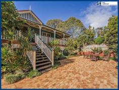  2361 Springbrook Rd Springbrook QLD 4213 This is a fantastic property right in the heart of Springbrook township.
 Set on a double-sized block - 1,376 m2 (on 2 titles) you'll have 
plenty of room for the family, the toys and the in-laws! A 
Queenslander-style home on two levels with great street appeal, it 
consists of 3 generous bedrooms plus office upstairs, and a further 2 
bedrooms plus extra living/games room downstairs which could easily be 
dual living. Beyond the double garage door lies a huge perfectly formed
 concreted area which offers a fantastic usable space for heaps of 
storage or even an extra workshop. Upstairs: - 3 bedrooms (main with ensuite) - separate study/office - large open plan loungeroom with slow combustion fire - large kitchen with quality appliances, gas & electric cooking - separate dining - polished timber floors - split-system air-conditioning - wrap around verandahs Downstairs: - 2 x bedrooms (without wardrobes) - Central games/lounge room - Laundry + separate toilet - Direct access to the 3 car garage + large concreted area Land: - 1,376 m2 over 2 titles - 2 x large rainwater tanks - Good rear vehicle access - Fully fenced 