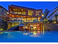 32 The Serpentine Bilgola NSW 2107 SHEER BEACHFRONT LUXURY Created by CABE, one of Australia’s preeminent development companies and winner of 31 industry awards, this is the ultimate seaside retreat for the cutting-edge Connoisseur. Apart from the breathtaking Oceanfront location and spectacular views across the Pacific Ocean and pristine coastline, the attention to detail and high quality fit-out, is nothing short of stunning. No expense has been spared in its creation, from the level street access with elevator to all floors, to the automated doors revealing a view-swept infinity pool and magnificent oceanfront lawn. Accommodation comprises 5 bedrooms, 4½ bathrooms, extensive living and entertaining areas, separate Home Office, thermo-controlled Wine Cellar, media room, gourmet kitchen and enormous storage areas. A rare offering in such a prized position, this luxury property is one that has definitely raised the bar for excellence in this country. *** BE SURE TO VIEW OUR AMAZING 2min VIDEO TOUR ONLINE AT maxwalls.com/id141