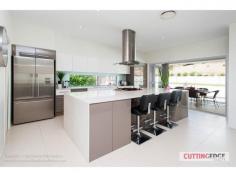  1 FLAME TREES CRES, MAUDSLAND, QLD 4210 Key Features:  *42sq living space * Sparkling I/G pool * Seamless indoor/outdoor entertaining * Gourmet kitchen -4 large bedrooms + study/5th Bed  -2bath + powder room  -4 separate living areas - Media Room, Family room, Upstairs Lounge, Dining  -Seamless flow from indoor/outdoor living via a series of bi-fold doors The heart of the home is the impressive gourmet kitchen a 'chef's delight complete with a massive 3.6m island bench,5 burner gas hob & S/S range hood,Extensive cupboard space with deep pot drawers  Integrated dishwasher, 900m oven, Vintec 50 bottle wine fridge, Walk in pantry/utility cupboard,Caesar stone tops,2pac finish,Glass splashbacks  -Master with North facing balcony, large ensuite with stand alone bath, double stone vanity, rainwater shower with frameless glass screens,large walk in dressing room with built in shelving & drawers  -Main bathroom with spa bath, stone vanity, frameless glass screens and floor to ceiling tiles  -Stylish timber see through staircase with glass balastrade  -High square set ceilings  -600x600 porcelain tiles throughout living area  -Fully tiled alfresco entertaining area under main roof  -Sparkling I/G pool with frameless glass fencing  -Reverse cycle Ducted Airconditioning  -Back to base security alarm system  -White Plantation Shutters  -Auto double lock up garage  -Elevated 745m2 block opposite parklands 