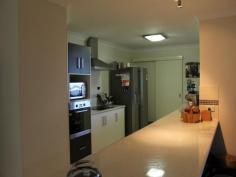  25 Discovery Crescent ROSSLYN Qld 4703 Have you been looking for a low-set brick home with 4 bedrooms + extra room that could be your media room or the children's play room.  1. Open plan kitchen,with ample cupboard space & large dining room.  2. 4 good size bedrooms with built-ins.  3. Main bedroom with ensuite.  4. Split systems in dining & kitchen area.  5. Fully fenced yard & entertainment area for your family to enjoy.  6. Side access & plenty of room to build the man a shed.  Call for inspection today. 