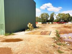 39 Fishburn St Cowra NSW 2794  The property is in an I2 Zone and has further development potential. A
 level, well fenced block in Fishburn St (a popular area for Light 
Industry), offering 1.88 HA (4.6 acres) in area & comprises a 93m 
frontage & 200m depth with 2 access points. Power, Phone and Water 
are available. Main shed constructed of steel frame and colorbond
 cladding and roof. It has a concrete floor, 3 large roller doors and 
one PA door. Adjoining this shed is a built-in weighbridge. 2nd shed is 
used for an office / staff area and is also colorbond construction. 
There is also an amenities modular building. (shower, hand basin, 
toilet) Call for more details. 0418 699080 Wayne Heilman   Property Snapshot Sale Price: By Negotiation Building Area: 250 m2 Site Area: 2 ha Property Type: Light Factory Uncovered Parking: 10 Total Parking: 10 Features: Container Access Heavy Vehicle Access Shower Vacant Possession Vehicle Access 